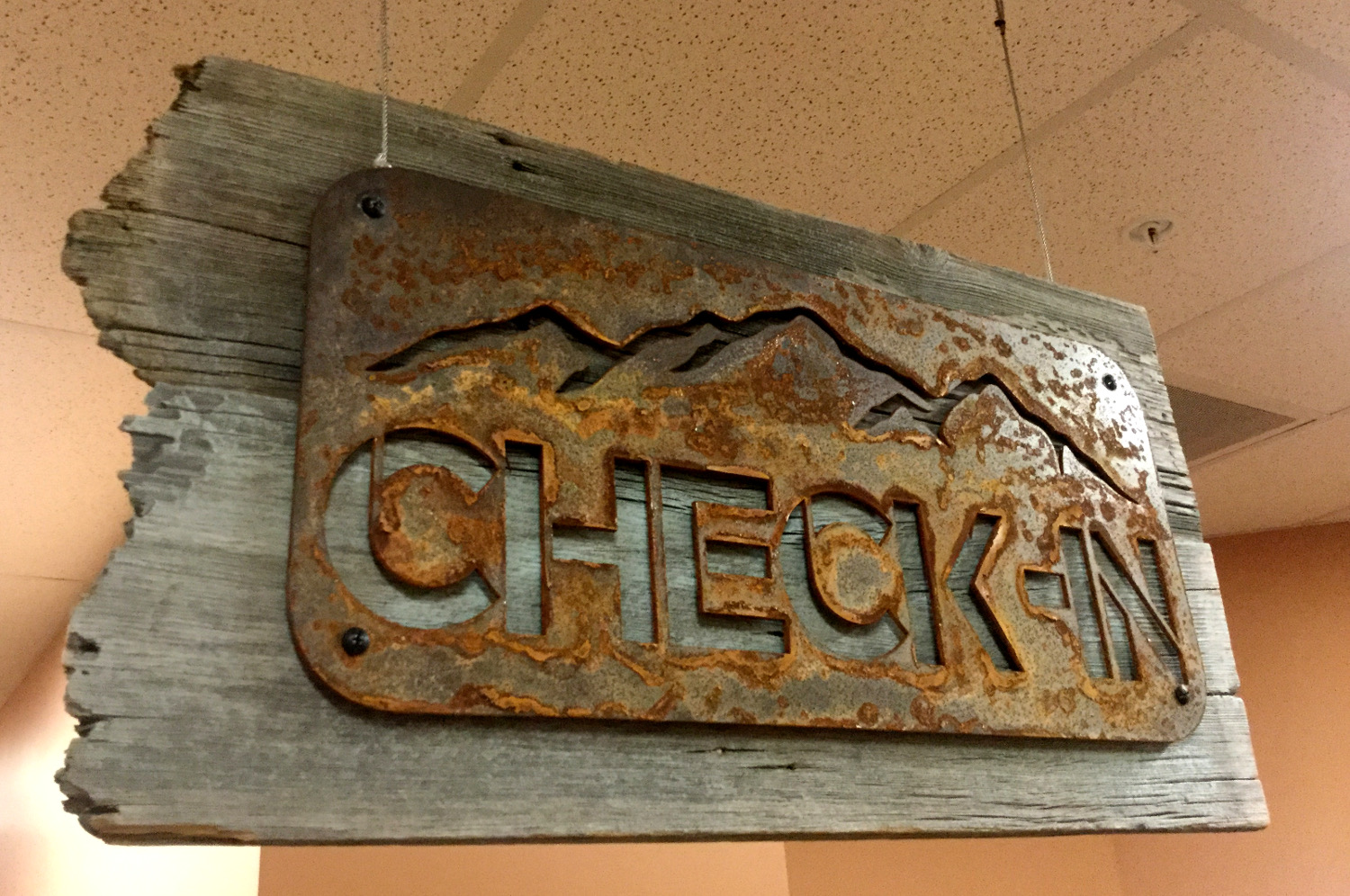 check in sign with mountain range rusted steel High-Volume Production Jobs – metal tabs